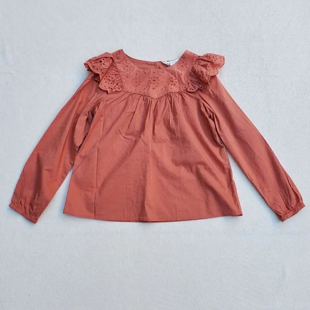 H&M rust long sleeve shirt with ruffle accent strip over the shoulders